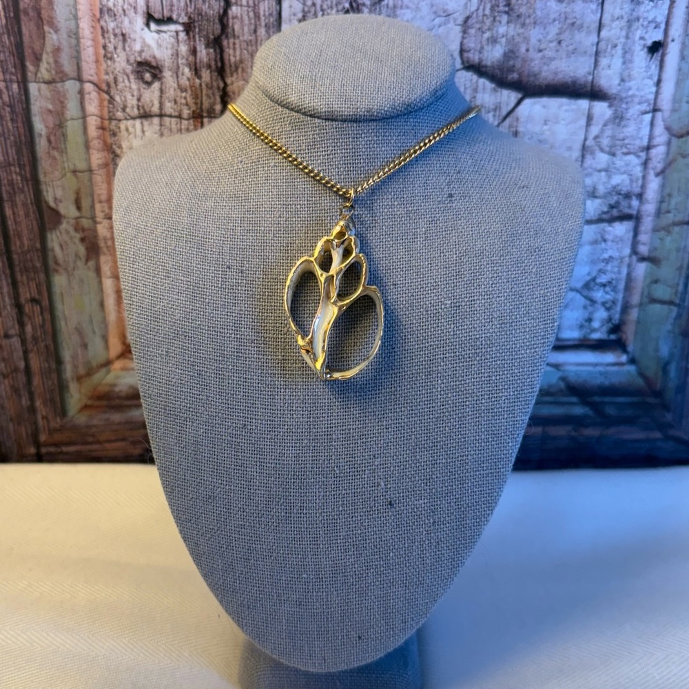 Gold-Washed Whelk Shell Pendant
Necklace